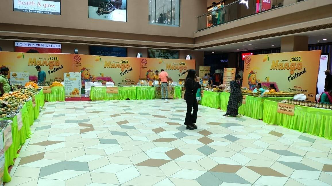 Mango Festival stalls arranged around a mall atrium.